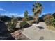 Landscaped backyard with patio and mature plants at 12226 N Lakeforest Dr, Sun City, AZ 85351