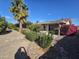 Backyard patio area with a seating area and landscaping at 12226 N Lakeforest Dr, Sun City, AZ 85351