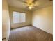 Spacious bedroom with neutral carpet and window coverings at 1324 W Michigan Ave, Phoenix, AZ 85023