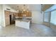 Open kitchen with island and stainless steel appliances at 1324 W Michigan Ave, Phoenix, AZ 85023