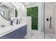 Modern bathroom with a stylish herringbone tile shower and floating vanity at 14667 N Love Ct, Fountain Hills, AZ 85268