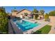 Relaxing pool area with patio, grill, and lush landscaping at 14667 N Love Ct, Fountain Hills, AZ 85268