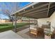 Relaxing backyard patio with seating and covered pergola at 1510 E Mission Ln, Phoenix, AZ 85020