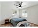 Cozy bedroom with wood flooring and ceiling fan at 1510 E Mission Ln, Phoenix, AZ 85020