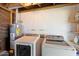 Laundry room with washer, dryer, and water heater at 1510 E Mission Ln, Phoenix, AZ 85020