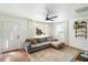 Living room features a gray sectional sofa and plenty of natural light at 1510 E Mission Ln, Phoenix, AZ 85020