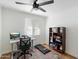 Home office with a standing desk, shelving, and treadmill at 1510 E Mission Ln, Phoenix, AZ 85020