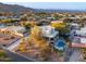 Modern home with a pool and stunning views of mountains and desert landscape at 15302 E Lotus Ln, Fountain Hills, AZ 85268