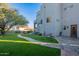 Artificial turf, stone pathway, and seating area in the backyard at 15302 E Lotus Ln, Fountain Hills, AZ 85268