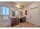 Double vanity bathroom with neutral tones and ample counter space at 15302 E Lotus Ln, Fountain Hills, AZ 85268