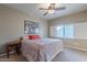 Spacious bedroom with king-size bed and window shutters at 15302 E Lotus Ln, Fountain Hills, AZ 85268