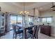 Elegant dining room with a wooden table and scenic views at 15302 E Lotus Ln, Fountain Hills, AZ 85268