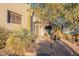 Ornate front entry with stone steps and mature trees at 15302 E Lotus Ln, Fountain Hills, AZ 85268