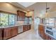 Well-lit kitchen with granite countertops, stainless steel appliances, and ample cabinet space at 15302 E Lotus Ln, Fountain Hills, AZ 85268