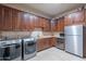 Laundry room with modern appliances and ample cabinet space at 15302 E Lotus Ln, Fountain Hills, AZ 85268