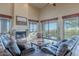 Living room with hardwood floors, fireplace, and scenic views at 15302 E Lotus Ln, Fountain Hills, AZ 85268