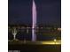 Night view of lake fountain with lights at 15302 E Lotus Ln, Fountain Hills, AZ 85268