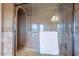 Spa-like shower with tile surround and built-in seat at 15302 E Lotus Ln, Fountain Hills, AZ 85268