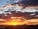 Orange and pink sunrise over mountains at 15302 E Lotus Ln, Fountain Hills, AZ 85268