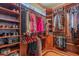 Spacious walk-in closet with ample shelving and hanging space at 15302 E Lotus Ln, Fountain Hills, AZ 85268