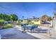 Large backyard with patio, grass, and basketball hoop at 1555 W 7Th Pl, Mesa, AZ 85201