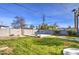 Backyard with grassy area, patio, and block wall at 1555 W 7Th Pl, Mesa, AZ 85201