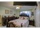 Elegant bedroom with a large bed, dresser, and ceiling fan at 1555 W 7Th Pl, Mesa, AZ 85201