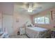 Charming bedroom with window, ceiling fan, and tiled floors at 1555 W 7Th Pl, Mesa, AZ 85201