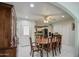 Formal dining room with a large wooden table and access to the kitchen at 1555 W 7Th Pl, Mesa, AZ 85201