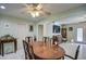 Spacious dining area with oval wood table, chairs, and access to other rooms at 1555 W 7Th Pl, Mesa, AZ 85201