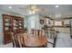 Dining room features a large wooden table and views into kitchen area at 1555 W 7Th Pl, Mesa, AZ 85201