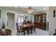 Bright dining room with wood table and chairs, and a large china cabinet at 1555 W 7Th Pl, Mesa, AZ 85201