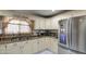 Modern kitchen with stainless steel appliances and granite countertops at 1555 W 7Th Pl, Mesa, AZ 85201