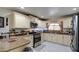 Updated kitchen boasts granite counters and stainless steel appliances at 1555 W 7Th Pl, Mesa, AZ 85201