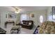 Bright living room with comfortable seating and a view into the dining area at 1555 W 7Th Pl, Mesa, AZ 85201