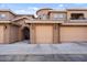 Tan stucco exterior with attached garage and landscaping at 15550 S 5Th Ave # 240, Phoenix, AZ 85045