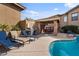 Community pool with a built-in grill and lounge chairs at 15550 S 5Th Ave # 240, Phoenix, AZ 85045