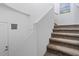 Modern staircase with carpeted steps and neutral wall colors at 15550 S 5Th Ave # 240, Phoenix, AZ 85045