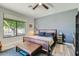 Relaxing bedroom with wood bed frame and large window at 15613 E Palomino Blvd, Fountain Hills, AZ 85268