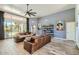 Bright living room with hardwood floors and sliding glass doors at 15613 E Palomino Blvd, Fountain Hills, AZ 85268