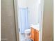 Small bathroom with shower/tub and wood vanity at 16846 W Hilton Ave, Goodyear, AZ 85338