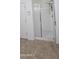 Bathroom with a glass shower and tile flooring at 16846 W Hilton Ave, Goodyear, AZ 85338