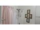 Bathroom with a showerhead and wall decor at 16846 W Hilton Ave, Goodyear, AZ 85338