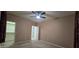 Bedroom with an open closet and a doorway at 16846 W Hilton Ave, Goodyear, AZ 85338