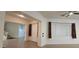 The grand entryway features tile flooring, a ceiling fan, a staircase, and natural light from a window at 16846 W Hilton Ave, Goodyear, AZ 85338