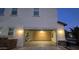 Garage with walls of built-in cabinets and storage, and overhead lighting at 16846 W Hilton Ave, Goodyear, AZ 85338