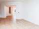 Bright hallway with tile floors and access to other rooms at 16846 W Hilton Ave, Goodyear, AZ 85338