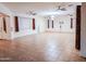 Spacious living room featuring tile floors and ceiling fans at 16846 W Hilton Ave, Goodyear, AZ 85338