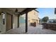 Cozy covered patio with view of stone accents and backyard at 16846 W Hilton Ave, Goodyear, AZ 85338