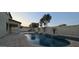 Inviting pool area with waterfalls and elegant landscaping at 16846 W Hilton Ave, Goodyear, AZ 85338